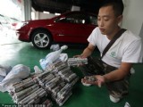 山西老板裝滿7個麻袋的硬幣買車
